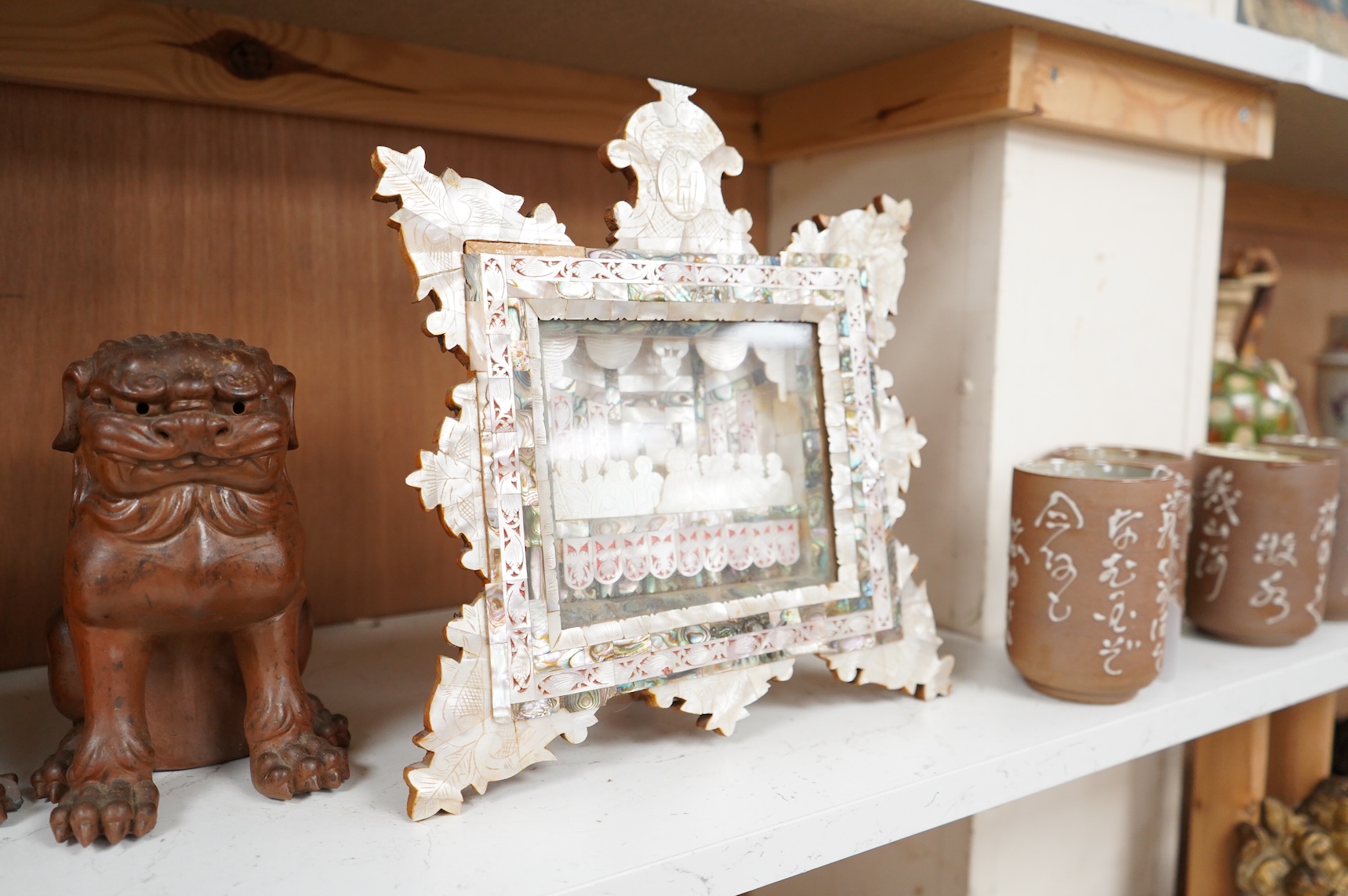 A mother of pearl carving and olivewood framed ‘The last supper’ panel, 30cm high